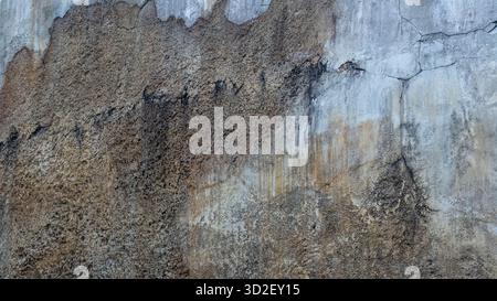 Extreme close-up of concrete surface showing granular stone detail and raw texture. Useful for wallpaper and backgrounds. Stock Photo
