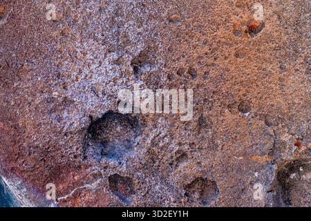 Extreme close-up of concrete surface showing granular stone detail and raw texture. Stock Photo