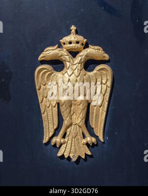 Gold Plated Double-Headed Eagle with Crown, Byzantine and Orthodox Symbol, on a Dark Background Stock Photo