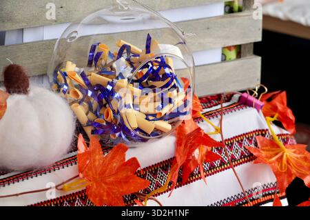 Colorful autumn leaves in the basket on the table. Fall background Stock Photo