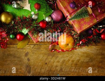Christmas shopping and christmas present concept with gift wrapped Christmas present boxes and Christmas balls and decoration. Flat lay Stock Photo
