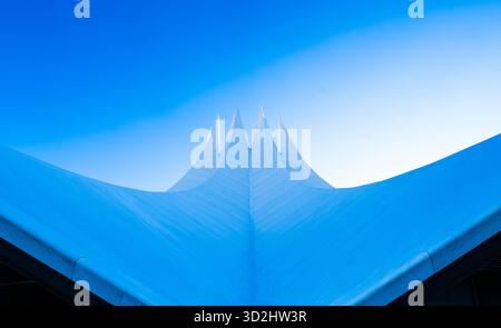 Futuristic architectural roof detail of the Tempodrom in Berlin against a clear blue sky Stock Photo