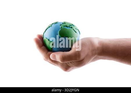 Planet Earth globe protected by hand isolated on white background with clipping path Stock Photo