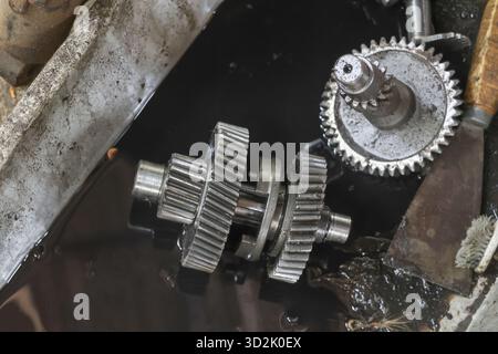 Close up mechanical gears, showing wear and tear, with sense of mechanical complexity and industrial application, evoking feeling of ruggedness and fu Stock Photo