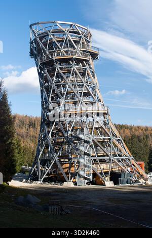 Tatras Tower, a modern wooden and steel observation tower structure in the High Tatras under blue sky. Stock Photo
