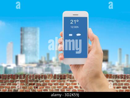 hand showing a telephone connected to wifi on the balcony of a building Stock Photo