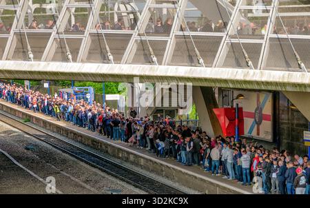 London, United Kingdom - May 13, 2018 - Crowd of people waiting at Wembley Stadium railway station in London, United Kingdom before football match. Stock Photo