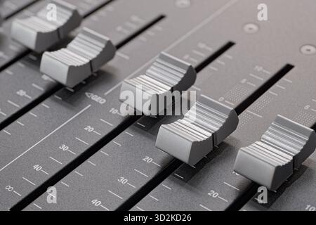 Generic audio mixing console, close up shot, abstract technology background Stock Photo