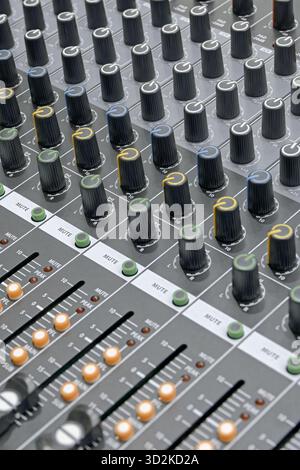 Generic audio mixing console, close up shot, abstract technology background Stock Photo