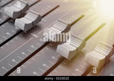 Generic audio mixing console, close up shot, abstract technology background Stock Photo