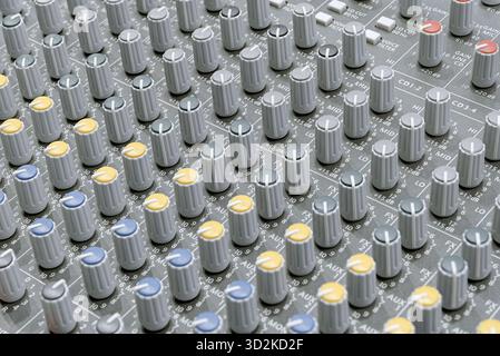 Generic audio mixing console, close up shot, abstract technology background Stock Photo