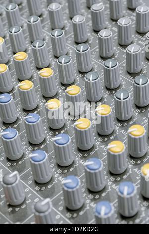 Generic audio mixing console, close up shot, abstract technology background Stock Photo