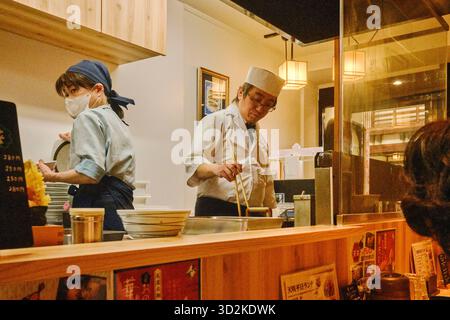 Chef cooking tempura in a tempura restaurant, Japan Stock Photo