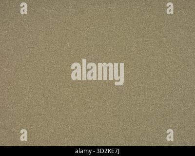 Shining with an understated glow, this textured gold paper whispers of luxury and refined grace Stock Photo