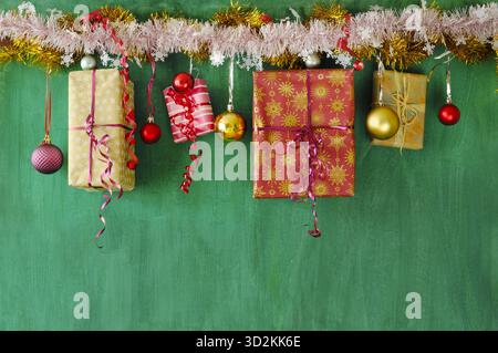 Christmas shopping and christmas present concept with gift wrapped Christmas present boxes and Christmas balls and decoration. Stock Photo