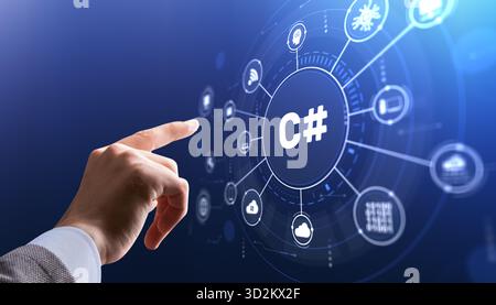Software developer interacts with C# programming icon on modern IDE interface for application development. Stock Photo