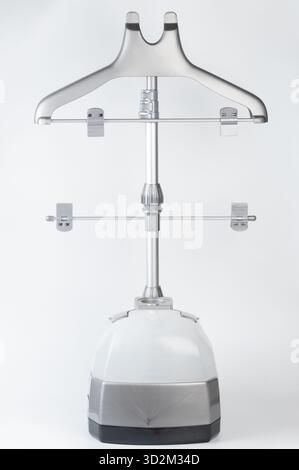 Plastic dress steamer with hand isolated on white background Stock Photo