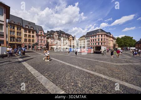 Square made of paving stones and marble slabs with pattern, row of houses, reconstructed historic buildings, outdoor area of a restaurant, lantern, pe Stock Photo