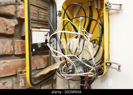 A switchboard with an electrical connecting cables and wi fi router box Stock Photo