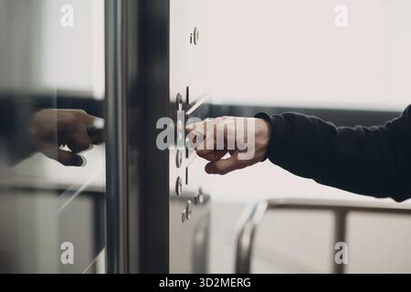 Close up of forefinger bone pressing the button elevator during coronavirus pandemic covid-19 safety rules Stock Photo