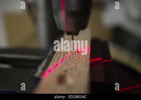 Drilling machine with laser sight in the workshop Stock Photo