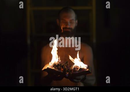 Man hold burning book in his hands Stock Photo
