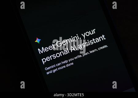 Mobile screen displaying the introduction to Google Gemini, a personal AI assistant. Stock Photo