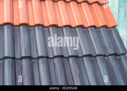 Samples of ceramic roofing tiles in a warehouse of a roofing materials store. Modern roof made of metal. cement sand tiles. Stock Photo