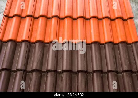 Samples of ceramic roofing tiles in a warehouse of a roofing materials store. Modern roof made of metal. cement sand tiles. Stock Photo