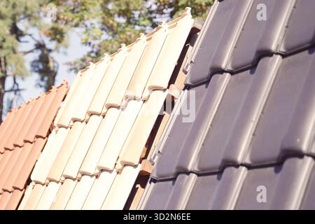 Samples of ceramic roofing tiles in a warehouse of a roofing materials store. Modern roof made of metal. cement sand tiles. Stock Photo