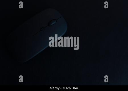 A white wireless computer mouse sits next to its USB receiver Stock ...