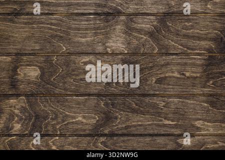 A wood textured background. Imitation of wooden planks painted with brown stain. Stock Photo