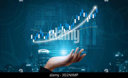 An artistic representation of a hand holding a digital graph showcasing stock market trends. The design features rising lines and bars in a futuristic Stock Photo