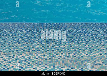 Small Blue and White Square Tiles Around Swimming Pool – Textured Mosaic Background Stock Photo