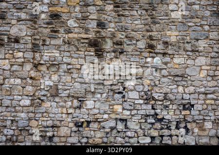 Old British Stone Wall Texture, Rustic Weathered Stone Background Stock Photo