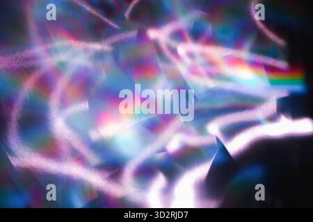 Soft colorful abstract background with blurred light reflections in purple, blue, and pink tones, creating a dreamy gradient texture. Stock Photo