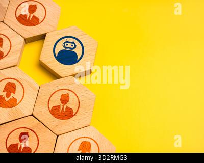 AI integration in human workforce concept with wooden blocks showing people and one robot icon. Represents artificial intelligence enhancing team perf Stock Photo