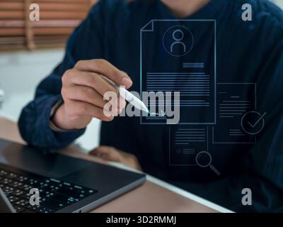 Businessman using digital pen to sign online document on virtual screen, symbolizing e-signature, online contract, and paperless business process. Con Stock Photo