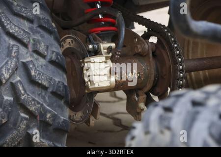 Close up of rusty off road vehicle brake mechanism showing wear and tear, evoking sense of ruggedness and adventure Stock Photo