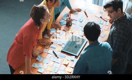 Top view of skilled programmer brainstorming idea about mobile phone interface while develop app development by using wireframe prototype. Web designe Stock Photo