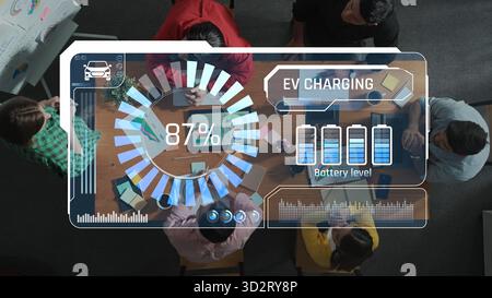 A vibrant office scene showcasing a diverse team collaborating around a table, with electric vehicle charging data displayed on a screen, emphasizing Stock Photo