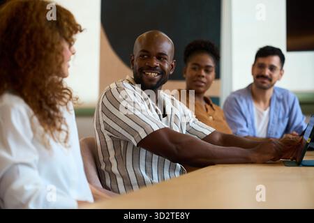 Diverse business team collaborating during office meeting Stock Photo