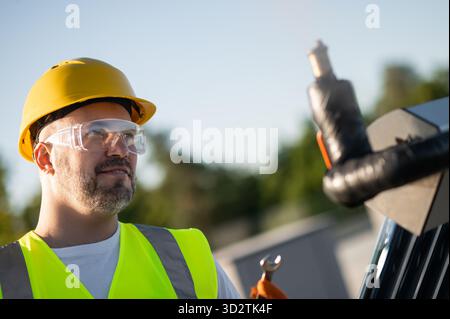 Professional technician working on solar heating structure Stock Photo