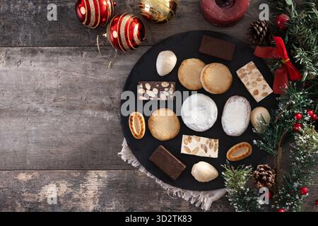 Traditional Spanish Christmas sweets assortment on wooden table. Stock Photo