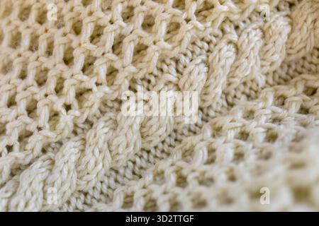 Cable knit sweater in cream wool Stock Photo
