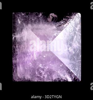 Amethyst pyramid, close-up, from above, isolated, on black background. Cut and polished semi-precious stone, with exact apex. Stock Photo