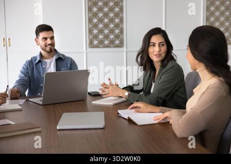Group of young professionals participating in meeting or briefing Stock Photo