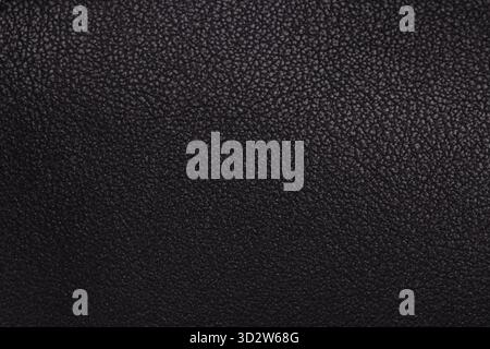 Detailed black grained leather surface. Stock Photo
