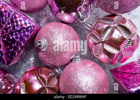 Pink Christmas tree decorations on bubble wrap Stock Photo