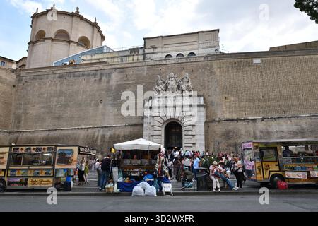 Visitors assemble outside the Vatican tour entrance in Rome, Italy Stock Photo